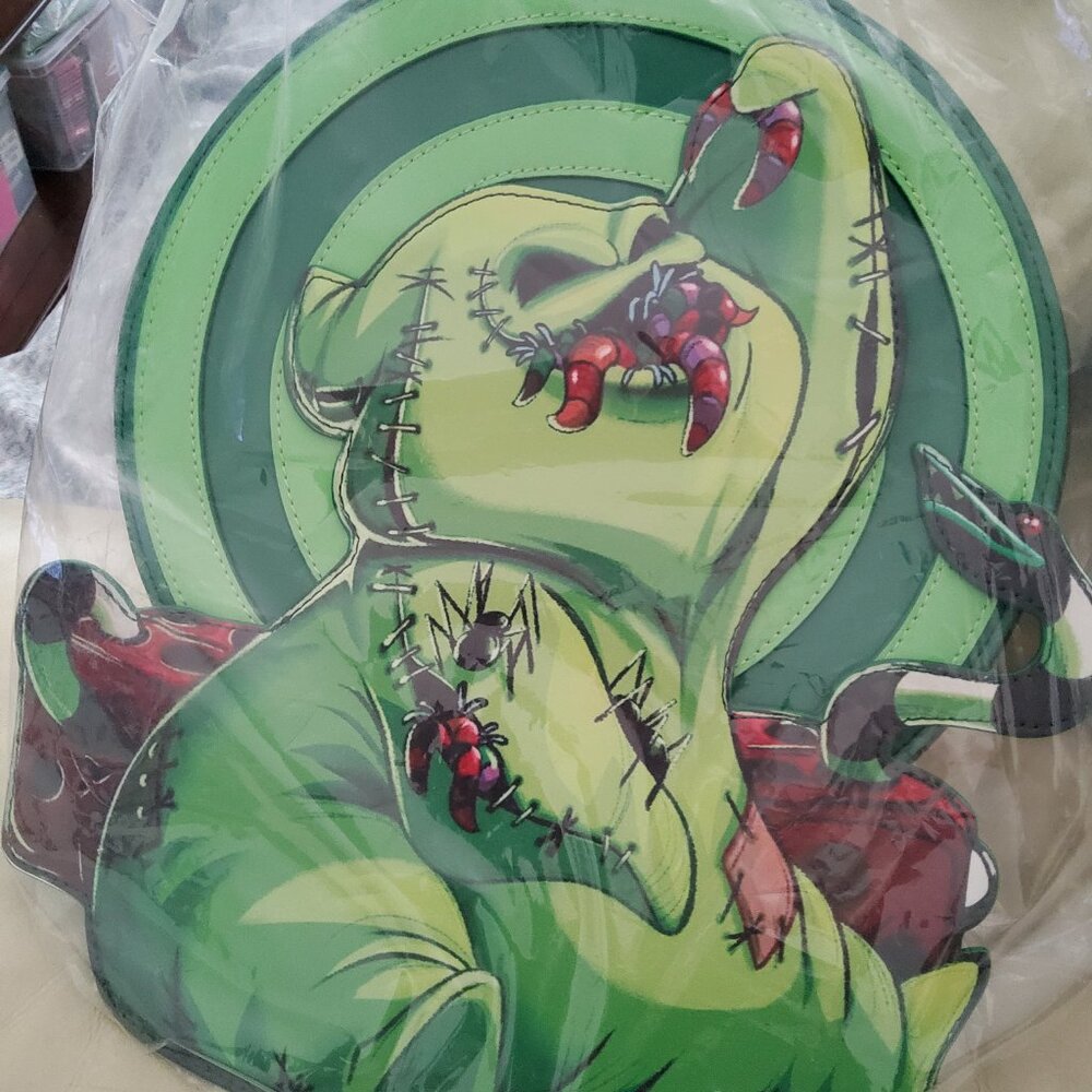 NIGHTMARE BEFORE CHRISTMAS  OOGIE BOOGIE GLOWS  BACKPACK RETIRED NWT SALE.